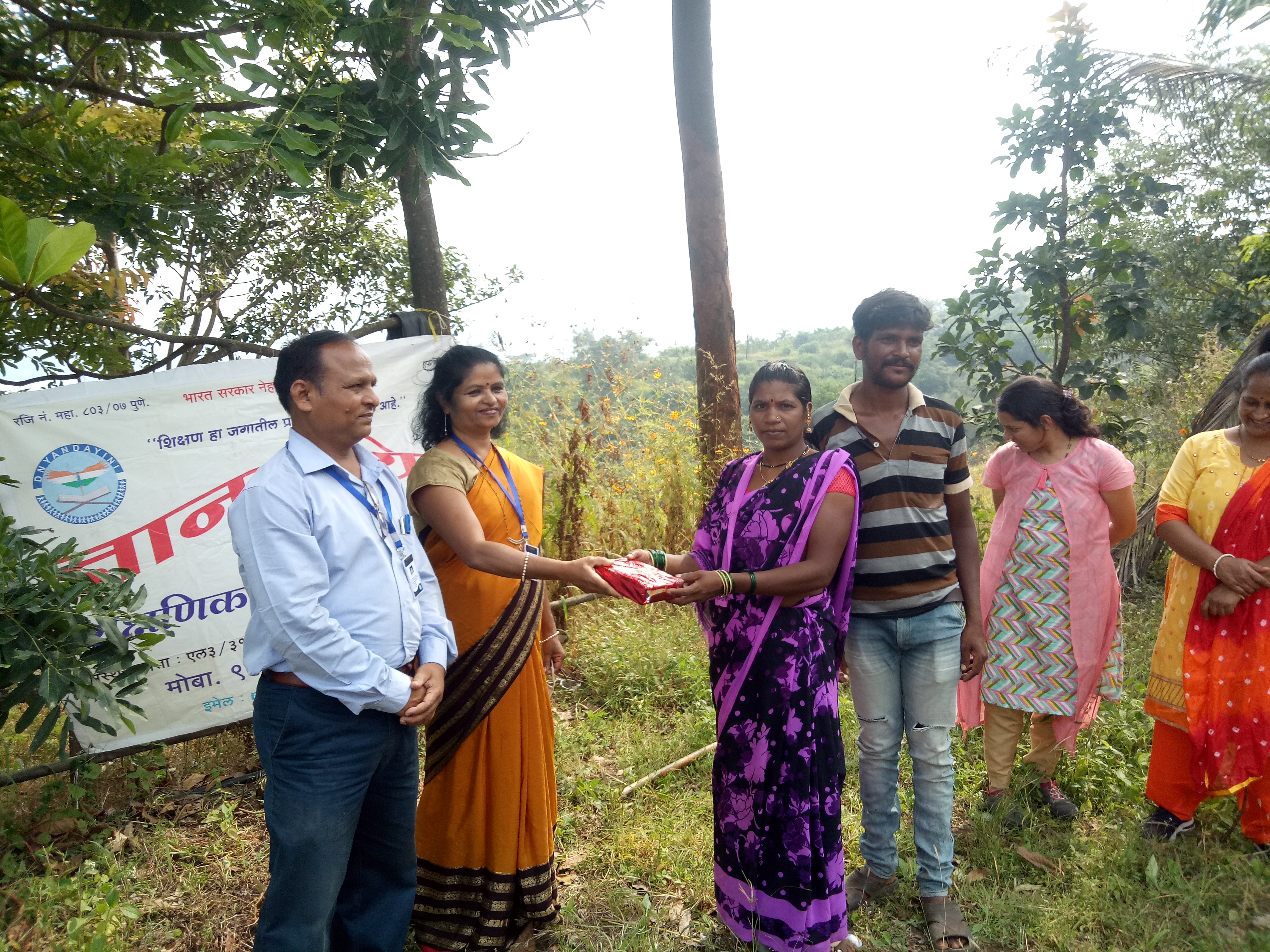 A side view of a plate of figs and berries. 